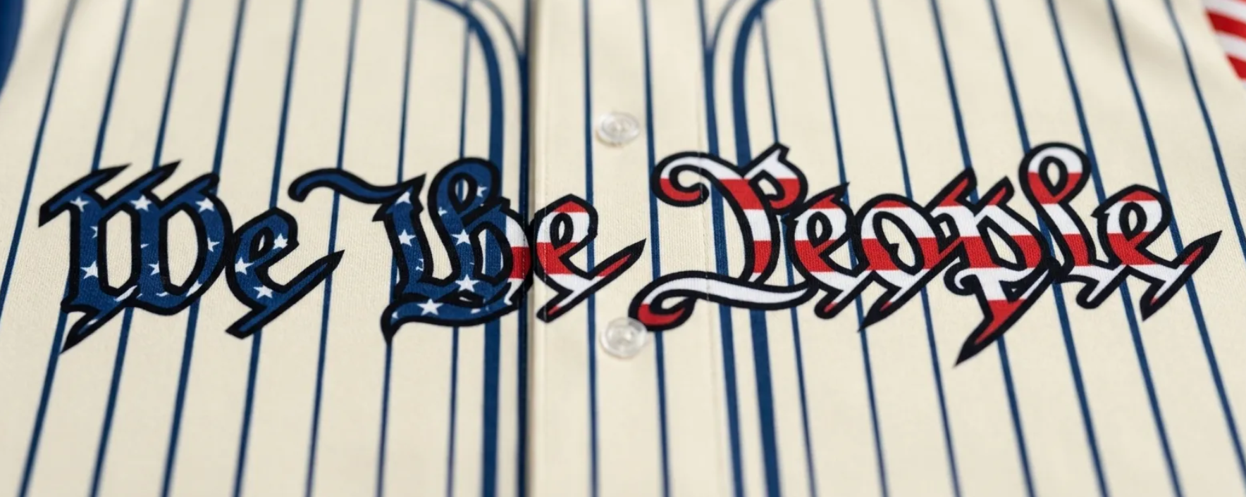 Detail of 'We The People' text on patriotic baseball jersey