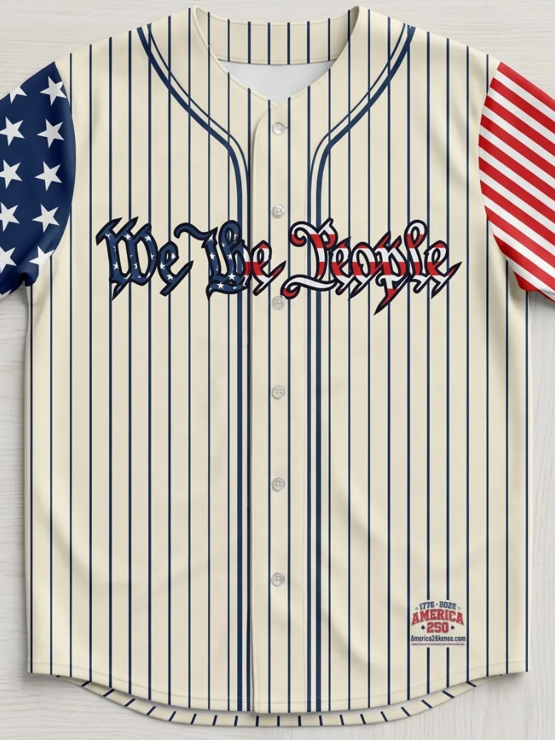 Close-up of patriotic baseball jersey with 'We The People' text and American flag sleeve design